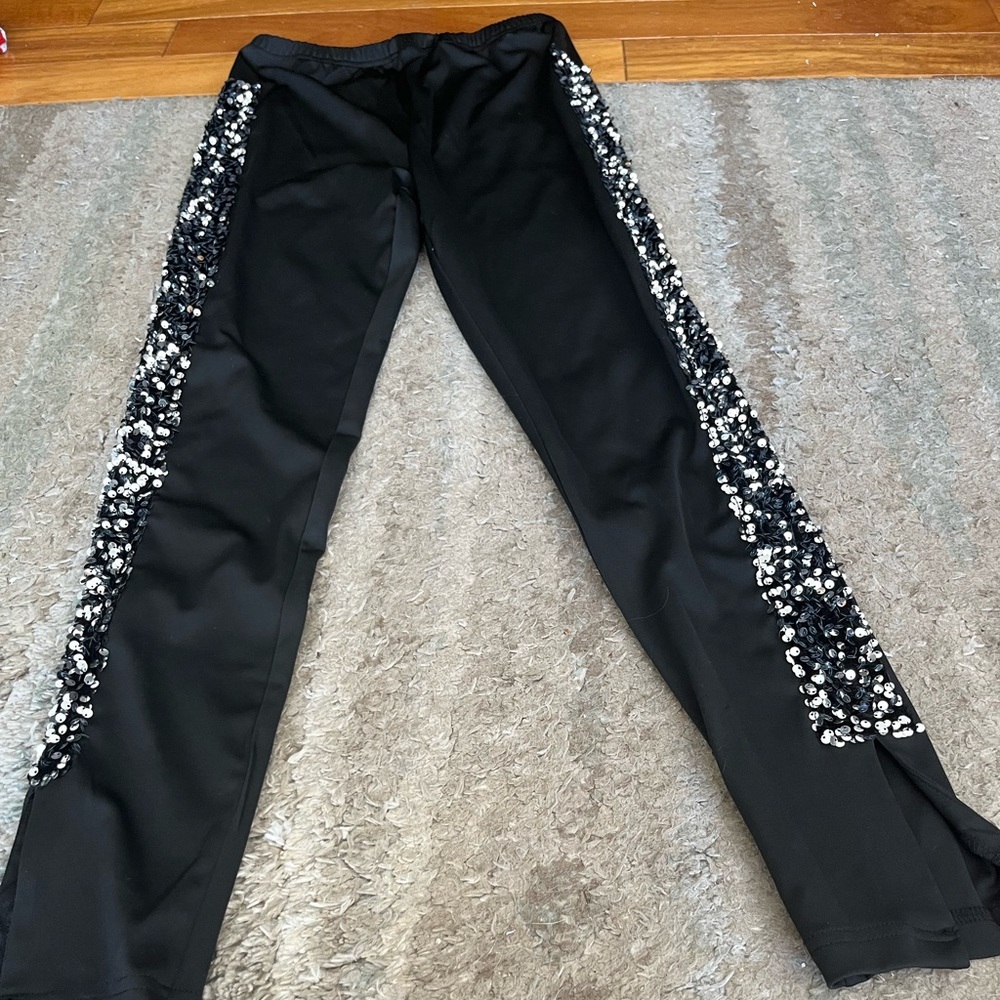 Women’s black leggings. small. Never worn. Silver and black sequins on sides